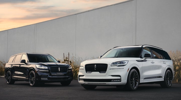 Two Lincoln Aviator® SUVs are shown with the available Jet Appearance Package | Irwin Lincoln Laconia in Laconia NH